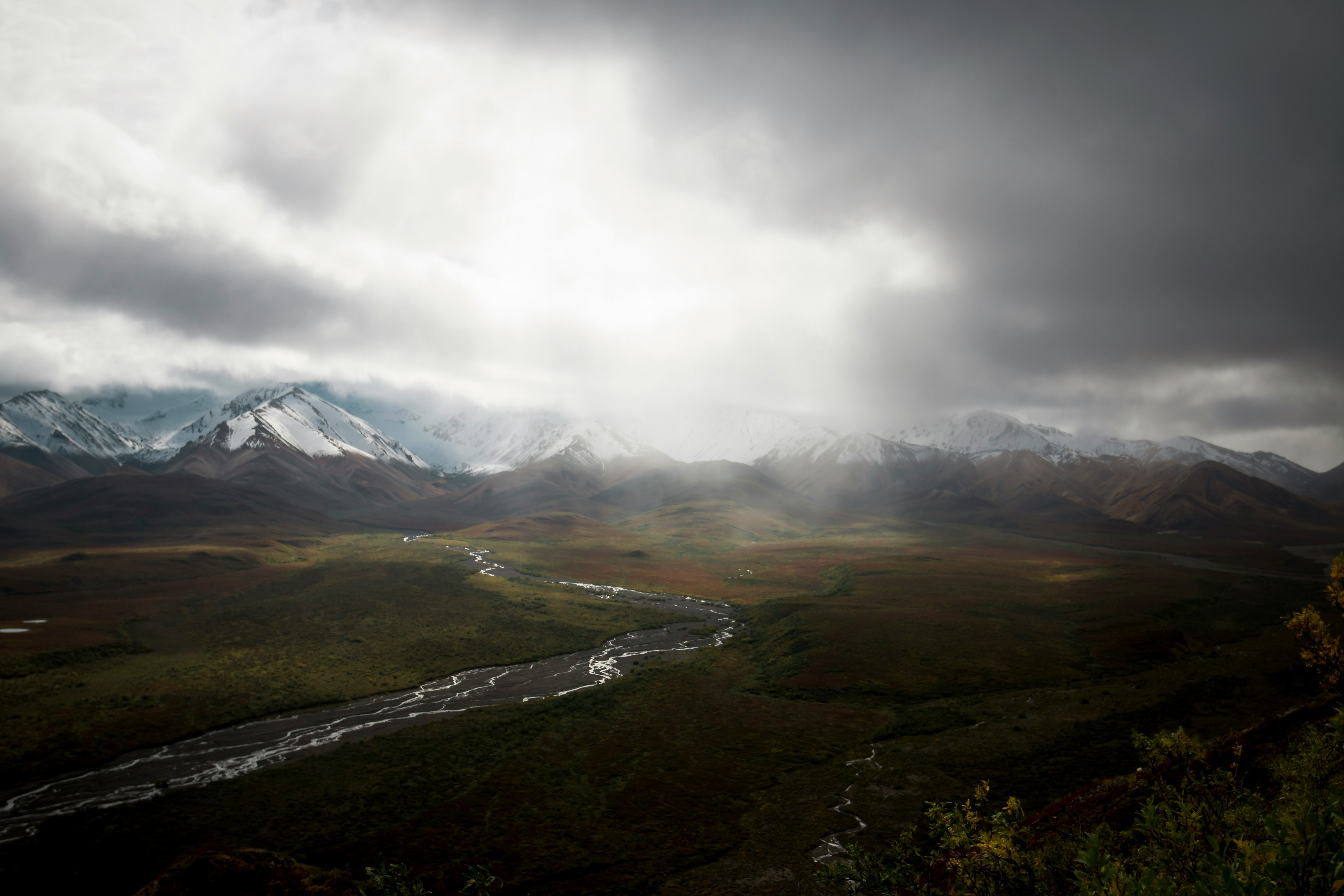 mountain range under white clouds during daytime